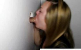 Blonde sucking cock through a glory hole